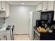 This kitchen features a new backsplash and white cabinets at 4225 38Th S Ave # 63C, St Petersburg, FL 33711
