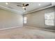 Primary bedroom with neutral walls and carpet flooring at 4975 Night Star Trl, Odessa, FL 33556
