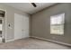 Neutral bedroom featuring a ceiling fan, large closet, and window at 4975 Night Star Trl, Odessa, FL 33556