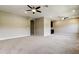 Open bonus room featuring neutral walls, ceiling fans and a wet bar at 4975 Night Star Trl, Odessa, FL 33556