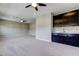 Spacious bonus room featuring a ceiling fan and wet bar at 4975 Night Star Trl, Odessa, FL 33556