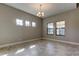 Dining room featuring neutral paint, light fixture, and tile flooring at 4975 Night Star Trl, Odessa, FL 33556