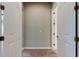 Hallway with two doors and light switch at 4975 Night Star Trl, Odessa, FL 33556