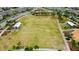 Large, green lawn and picnic area with covered structure in a residential neighborhood at 4975 Night Star Trl, Odessa, FL 33556