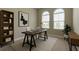 Stylish home office featuring a modern desk, shelving, and arched windows providing ample natural light at 4975 Night Star Trl, Odessa, FL 33556