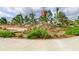 Community playground with a slide, trees, and seating areas for families at 4975 Night Star Trl, Odessa, FL 33556