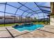 Luxurious screened-in pool, with well-maintained landscaping, perfect for relaxation and entertainment at 4975 Night Star Trl, Odessa, FL 33556