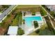 Aerial view of the resort-style pool and lounge area with ample seating at 4975 Night Star Trl, Odessa, FL 33556