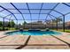 Enjoy the Florida sun with a screened-in pool and paver deck featuring fountains and a relaxing in-ground spa at 4975 Night Star Trl, Odessa, FL 33556