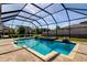Inviting screened-in pool with manicured landscaping, perfect for relaxation and entertainment at 4975 Night Star Trl, Odessa, FL 33556