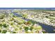 Aerial view of a waterfront property in a neighborhood with canal access at 512 Flamingo Dr, Apollo Beach, FL 33572
