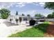 Backyard showcasing a patio, outdoor dining area, grill, hot tub, and well-maintained lawn at 512 Flamingo Dr, Apollo Beach, FL 33572