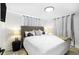 Relaxing bedroom with a comfortable bed, stylish headboard, and soft, ambient lighting at 512 Flamingo Dr, Apollo Beach, FL 33572