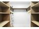 Walk-in closet with custom shelving, providing ample storage for clothes and accessories at 512 Flamingo Dr, Apollo Beach, FL 33572