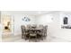 Bright dining room with a round dining table, seating for eight, and hardwood floors at 512 Flamingo Dr, Apollo Beach, FL 33572