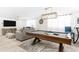 Entertainment room features a pool table and ample seating for a relaxing, fun atmosphere at 512 Flamingo Dr, Apollo Beach, FL 33572