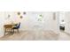Bright hallway features hardwood floors, leading to a bedroom and the home's entrance at 512 Flamingo Dr, Apollo Beach, FL 33572