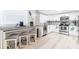 Bright kitchen boasts a breakfast bar, stainless appliances, and stylish white cabinetry at 512 Flamingo Dr, Apollo Beach, FL 33572