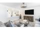 Inviting living room features cozy seating, a modern entertainment center, and neutral decor at 512 Flamingo Dr, Apollo Beach, FL 33572