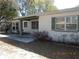 Charming single-story home with covered porch and well-maintained landscaping, providing inviting curb appeal at 5318 7Th N Ave, St Petersburg, FL 33710