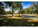 Scenic community basketball courts surrounded by lush trees, perfect for outdoor activities and recreation at 6607 Gates Pointe Way, Riverview, FL 33578