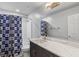 Bathroom features single vanity with marble counters, cowboy-themed shower curtain, and modern fixtures at 6607 Gates Pointe Way, Riverview, FL 33578