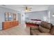 Bedroom featuring wood-look flooring, ample closet space, and natural light from large windows at 6607 Gates Pointe Way, Riverview, FL 33578