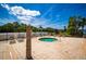 Relaxing community hot tub with nearby chairs and a view of the peaceful lake at 6607 Gates Pointe Way, Riverview, FL 33578
