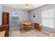 Dining room with wood floors, natural light, and lake views, offering a serene dining experience at 6607 Gates Pointe Way, Riverview, FL 33578
