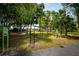 Outdoor exercise area with various fitness stations, set amongst trees, promoting an active lifestyle within the community at 6607 Gates Pointe Way, Riverview, FL 33578