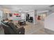 Spacious living room featuring laminate floors and comfortable leather seating at 6607 Gates Pointe Way, Riverview, FL 33578