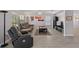 Bright living room with new laminate floors, comfortable seating, and abundant natural light at 6607 Gates Pointe Way, Riverview, FL 33578