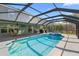 Inviting screened-in pool with spa, patio, and outdoor dining area for relaxing and entertaining at 6607 Gates Pointe Way, Riverview, FL 33578