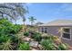 Backyard landscaping featuring paver stones, mature trees, and a tranquil outdoor atmosphere at 708 Sandy Hills Ave, Tarpon Springs, FL 34689