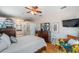 Bright bedroom with ceiling fan, walk-in closet, access to the bathroom and sitting area at 708 Sandy Hills Ave, Tarpon Springs, FL 34689