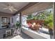 Screened in lanai featuring shade, neutral colors, and comfortable seating to enjoy the outdoors at 708 Sandy Hills Ave, Tarpon Springs, FL 34689