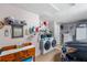 Inside laundry room with white washer and dryer and built-in shelving at 708 Sandy Hills Ave, Tarpon Springs, FL 34689