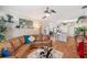 Open-concept living room seamlessly connects to dining area and kitchen with bar seating at 708 Sandy Hills Ave, Tarpon Springs, FL 34689