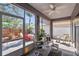Relaxing sun room with comfortable seating, plenty of light, and peaceful backyard views at 708 Sandy Hills Ave, Tarpon Springs, FL 34689