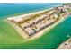 Stunning aerial view of beachfront condos with private beach access and turquoise waters at 7480 Bayshore Dr # 402, Treasure Island, FL 33706