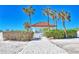 Pathway to the beach featuring a quaint gazebo and lush landscaping, offering a serene oasis for relaxation at 7480 Bayshore Dr # 402, Treasure Island, FL 33706