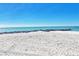 Beautiful beach view from the sand, with tranquil ocean views and rocks creating a serene atmosphere at 7480 Bayshore Dr # 402, Treasure Island, FL 33706