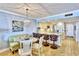 Kitchen and dining area featuring breakfast bar seating, stainless appliances, and tiled backsplash at 7480 Bayshore Dr # 402, Treasure Island, FL 33706