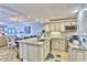 Modern kitchen with granite countertops, stainless steel appliances, and an open layout to the dining and living areas at 7480 Bayshore Dr # 402, Treasure Island, FL 33706