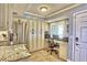 A kitchen featuring ample cabinet space, stainless steel appliances, and a workstation with natural light at 7480 Bayshore Dr # 402, Treasure Island, FL 33706