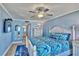 Cozy main bedroom featuring a ceiling fan and ensuite bathroom with updated vanity at 7480 Bayshore Dr # 402, Treasure Island, FL 33706