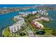 Aerial view of waterfront community with boat docks and fountains at 7872 Sailboat Key S Blvd # 306, South Pasadena, FL 33707