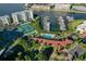 Aerial view of community featuring tennis courts, pool, and marina access at 7872 Sailboat Key S Blvd # 306, South Pasadena, FL 33707