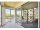 Spacious balcony with tiled flooring and open views of the neighborhood and palm trees at 7872 Sailboat Key S Blvd # 306, South Pasadena, FL 33707