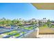 Balcony view with palm trees, buildings, and clear blue skies at 7872 Sailboat Key S Blvd # 306, South Pasadena, FL 33707